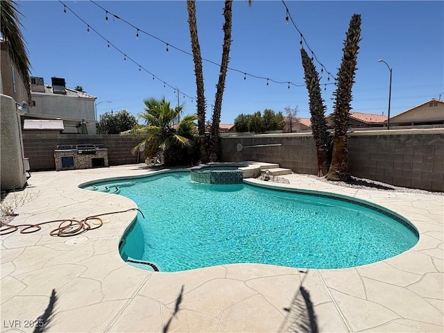 3679 Funston Way, Las Vegas, NV 89129 - view of swimming pool featuring a fenced backyard, a patio, a pool with connected hot tub, and an outdoor kitchen