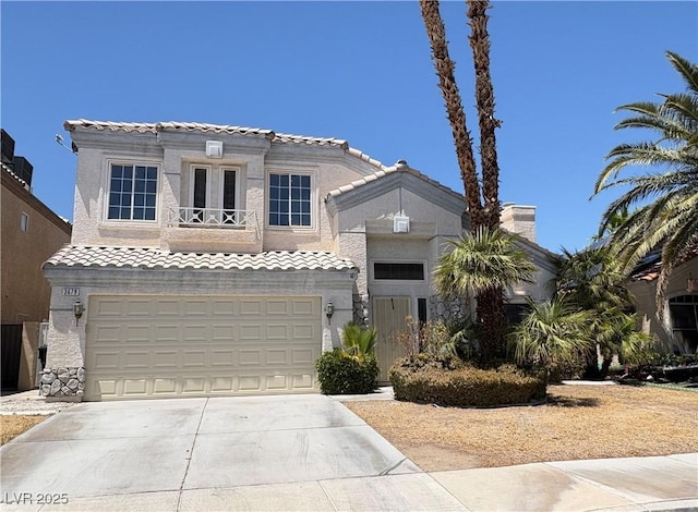 3679 Funston Way, Las Vegas, NV 89129 - mediterranean / spanish house with driveway, a tile roof, a garage, and stucco siding