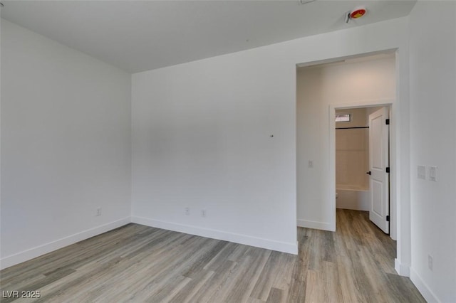 383 N 16th St, Las Vegas, NV 89101 - empty room with light wood-type flooring and baseboards