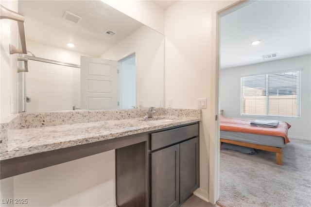 518 Descubir Ave, North Las Vegas, NV 89081 - full bath with vanity, connected bathroom, an enclosed shower, and recessed lighting