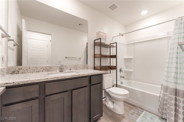 518 Descubir Ave, North Las Vegas, NV 89081 - bathroom with shower / bathtub combination with curtain, vanity, and wood finished floors