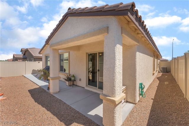 518 Descubir Ave, North Las Vegas, NV 89081 - back of property featuring stucco siding, a fenced backyard, a patio area, and a tile roof