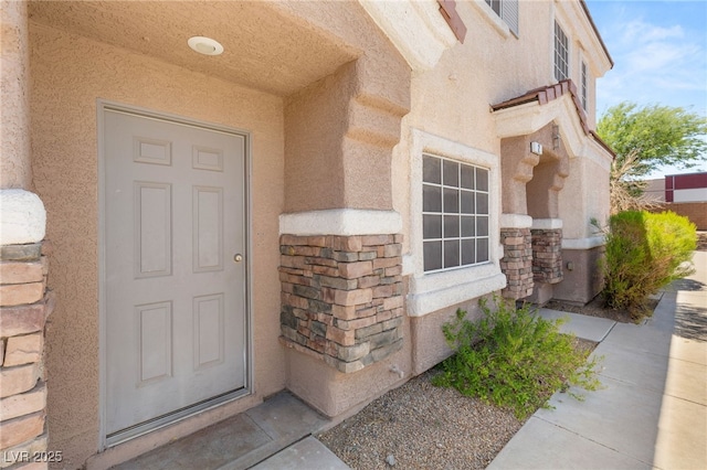 89 Day Trade St Unit 1, Henderson, NV 89074 - view of exterior entry with stucco siding and stone siding