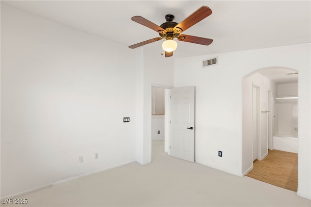89 Day Trade St Unit 1, Henderson, NV 89074 - unfurnished bedroom with arched walkways, carpet floors, and ceiling fan