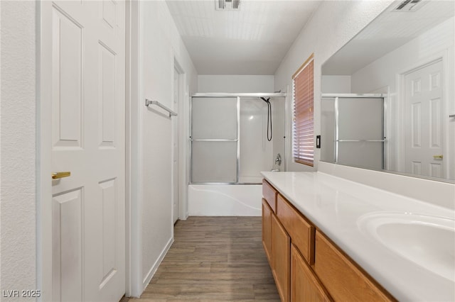 89 Day Trade St Unit 1, Henderson, NV 89074 - full bathroom with vanity, wood finished floors, and bath / shower combo with glass door