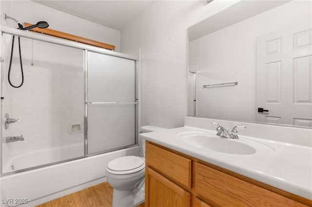 89 Day Trade St Unit 1, Henderson, NV 89074 - bathroom featuring vanity, wood finished floors, and combined bath / shower with glass door