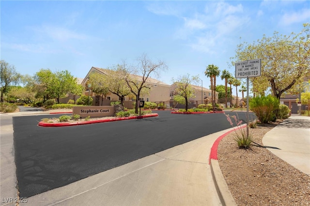 89 Day Trade St Unit 1, Henderson, NV 89074 - view of asphalt street featuring curbs, a residential view, and sidewalks