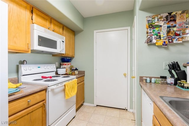 7255 W Sunset Rd Unit 2030, Las Vegas, NV 89113 - kitchen with white appliances and light countertops
