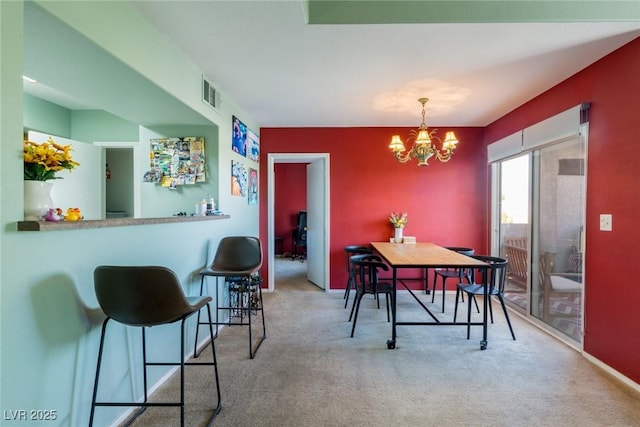 7255 W Sunset Rd Unit 2030, Las Vegas, NV 89113 - dining room with carpet and a chandelier