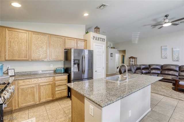 1208 Neva Ranch Ave, North Las Vegas, NV 89081 - kitchen with appliances with stainless steel finishes, vaulted ceiling, light tile patterned flooring, open floor plan, and ceiling fan