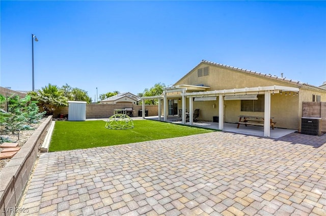 1208 Neva Ranch Ave, North Las Vegas, NV 89081 - back of property with a patio, a pergola, a storage shed, a fenced backyard, and stucco siding
