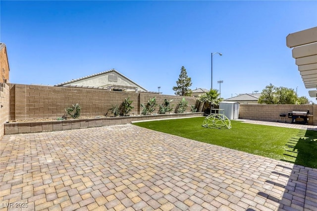1208 Neva Ranch Ave, North Las Vegas, NV 89081 - fenced backyard featuring a storage unit and a patio