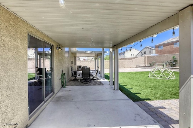 1208 Neva Ranch Ave, North Las Vegas, NV 89081 - fenced backyard with a patio and outdoor dining space