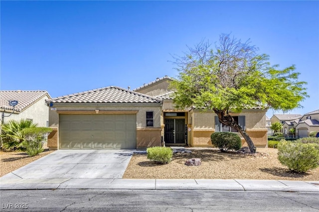 1208 Neva Ranch Ave, North Las Vegas, NV 89081 - view of front of house with an attached garage, stucco siding, driveway, and a tile roof