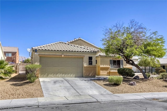 1208 Neva Ranch Ave, North Las Vegas, NV 89081 - view of front facade with driveway, a garage, a tile roof, and stucco siding
