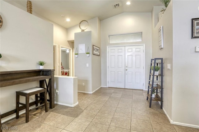 1208 Neva Ranch Ave, North Las Vegas, NV 89081 - entryway featuring light tile patterned floors and high vaulted ceiling