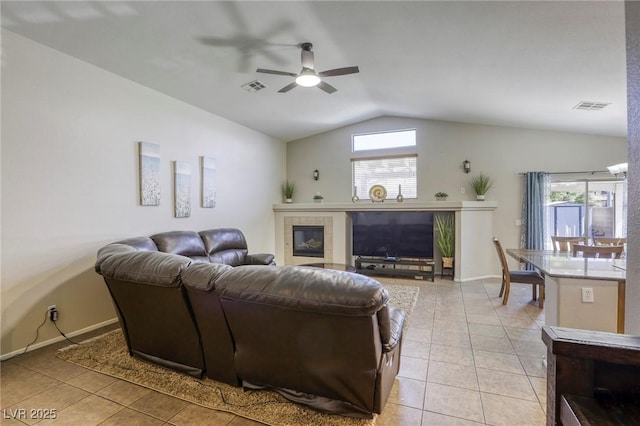 1208 Neva Ranch Ave, North Las Vegas, NV 89081 - living room featuring lofted ceiling, a ceiling fan, light tile patterned flooring, and healthy amount of natural light