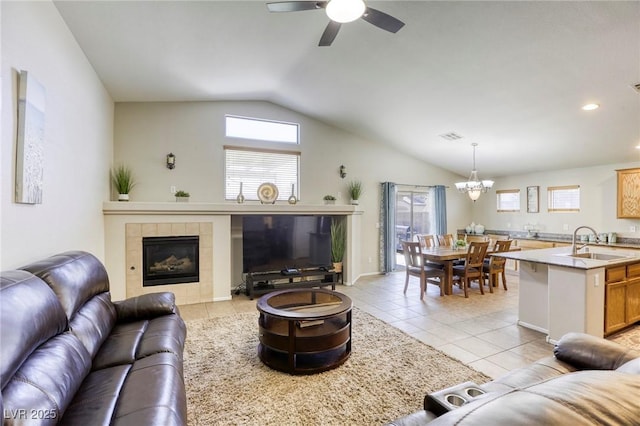 1208 Neva Ranch Ave, North Las Vegas, NV 89081 - living area with lofted ceiling, light tile patterned flooring, a ceiling fan, plenty of natural light, and a chandelier