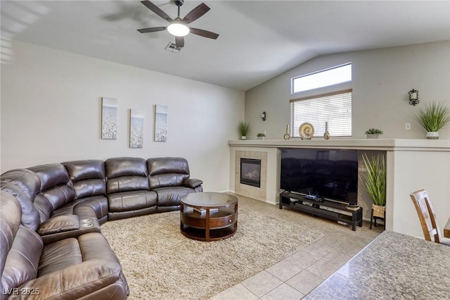 1208 Neva Ranch Ave, North Las Vegas, NV 89081 - tiled living area with lofted ceiling, a ceiling fan, and a tiled fireplace