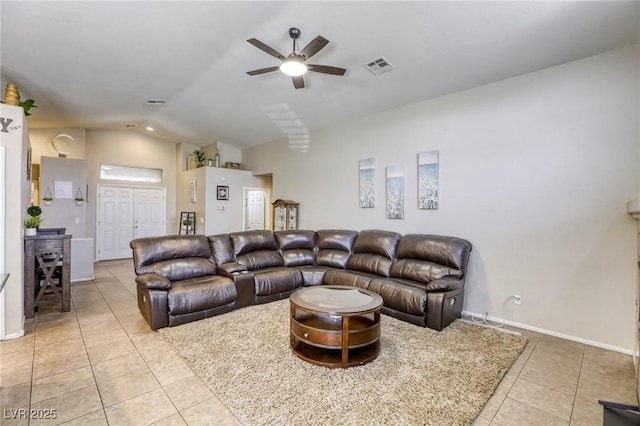 1208 Neva Ranch Ave, North Las Vegas, NV 89081 - living area featuring light tile patterned floors, lofted ceiling, and ceiling fan