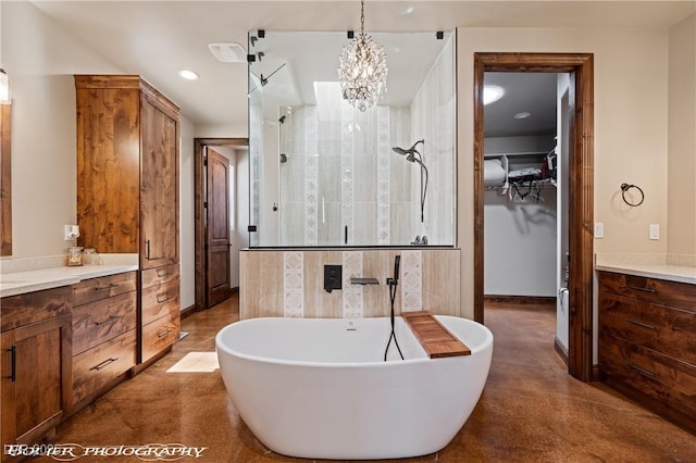 479 Apogee Crst, Mesquite, NV 89027 - full bathroom with vanity, tiled shower, a freestanding tub, recessed lighting, and a spacious closet