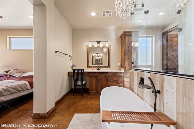 479 Apogee Crst, Mesquite, NV 89027 - bathroom featuring a soaking tub, a shower stall, vanity, ensuite bath, and recessed lighting