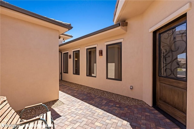 479 Apogee Crst, Mesquite, NV 89027 - view of exterior entry with stucco siding and a patio area