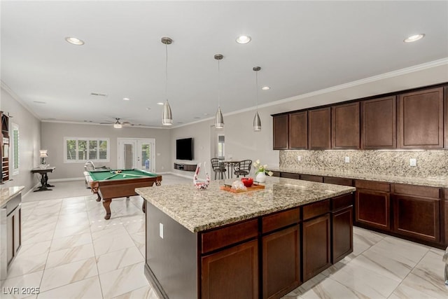 1304 Fantastic Ct, North Las Vegas, NV 89081 - kitchen featuring light marble finish floors, crown molding, recessed lighting, billiards, and open floor plan