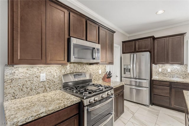 1304 Fantastic Ct, North Las Vegas, NV 89081 - kitchen with appliances with stainless steel finishes, crown molding, dark brown cabinets, light stone countertops, and light marble finish floors