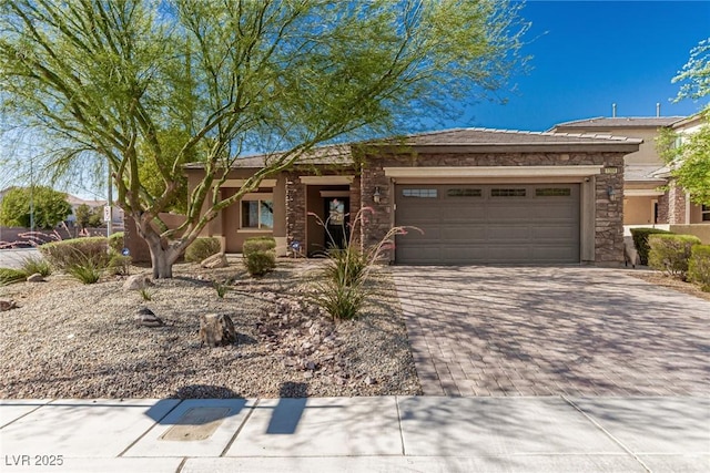 1304 Fantastic Ct, North Las Vegas, NV 89081 - view of front of property featuring stone siding, a garage, decorative driveway, and stucco siding