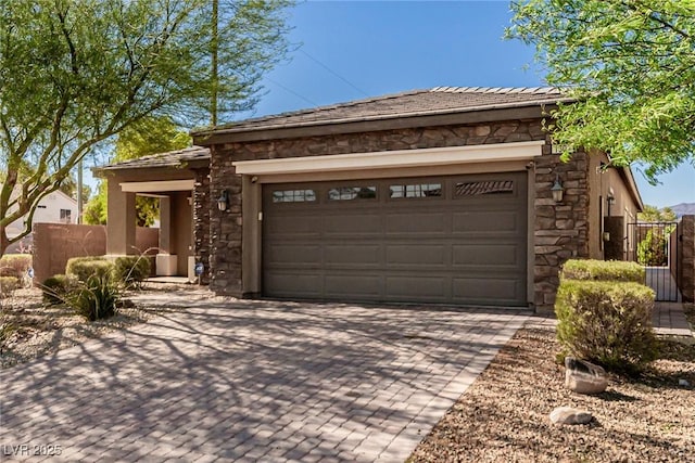 1304 Fantastic Ct, North Las Vegas, NV 89081 - view of front of property featuring stone siding, decorative driveway, and a garage