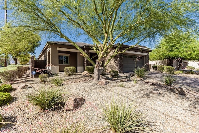 1304 Fantastic Ct, North Las Vegas, NV 89081 - view of front facade with a garage and stucco siding