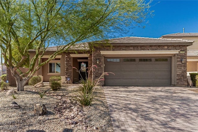 1304 Fantastic Ct, North Las Vegas, NV 89081 - view of front of property with an attached garage, decorative driveway, stone siding, and stucco siding