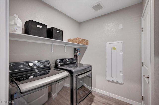 3358 Via Strada St, Henderson, NV 89044 - laundry room with washer and clothes dryer and wood finished floors