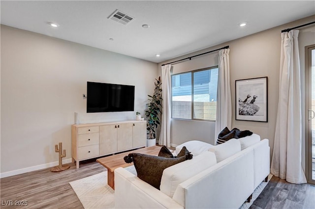 3358 Via Strada St, Henderson, NV 89044 - living room featuring light wood-type flooring and recessed lighting