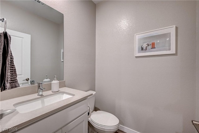 3358 Via Strada St, Henderson, NV 89044 - half bathroom with vanity and a textured wall