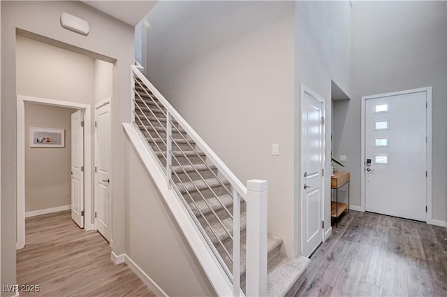 3358 Via Strada St, Henderson, NV 89044 - stairs with wood finished floors and a towering ceiling