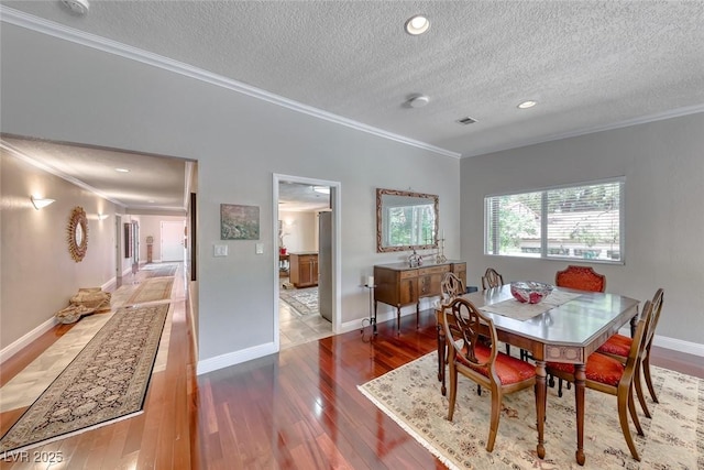 2101 Plaza Del Fuentes, Las Vegas, NV 89102 - dining space with ornamental molding, a textured ceiling, hardwood / wood-style flooring, and recessed lighting