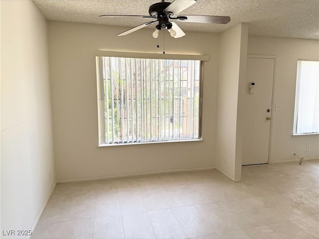 4338 Caliente St Unit 12, Las Vegas, NV 89119 - tiled spare room featuring a ceiling fan, a textured ceiling, and plenty of natural light