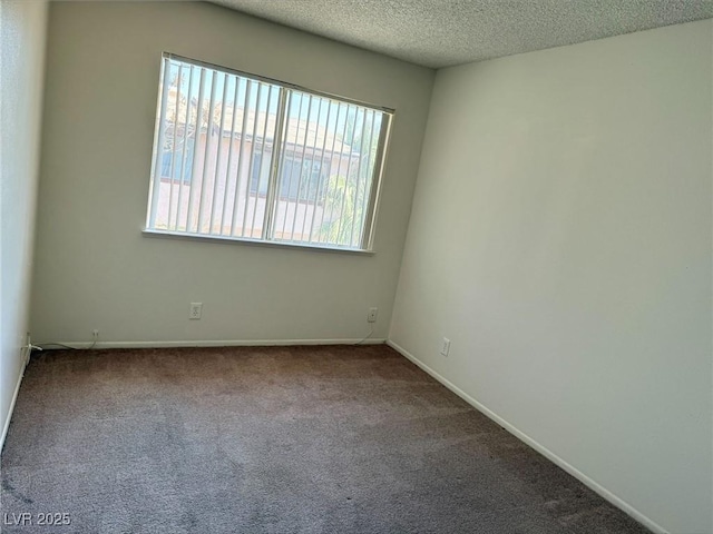 4338 Caliente St Unit 12, Las Vegas, NV 89119 - spare room with carpet and a textured ceiling