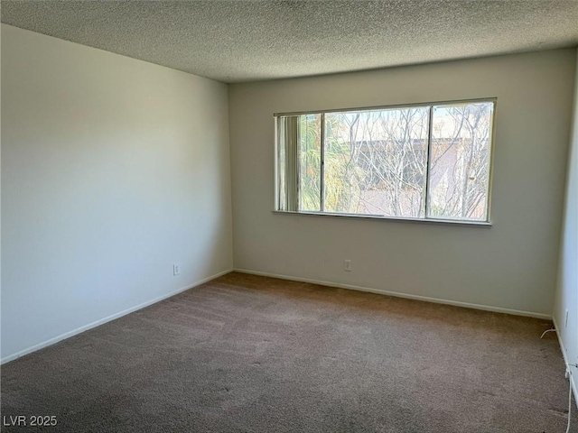 4338 Caliente St Unit 12, Las Vegas, NV 89119 - unfurnished room with carpet floors and a textured ceiling