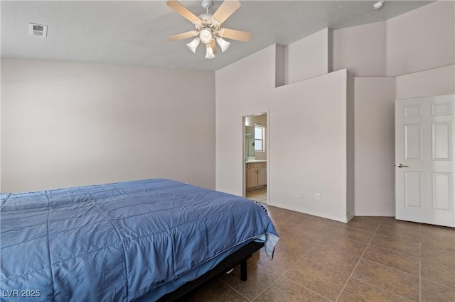 871 Falcon Glenn Dr, Mesquite, NV 89027 - bedroom with tile patterned flooring, ensuite bathroom, and a ceiling fan