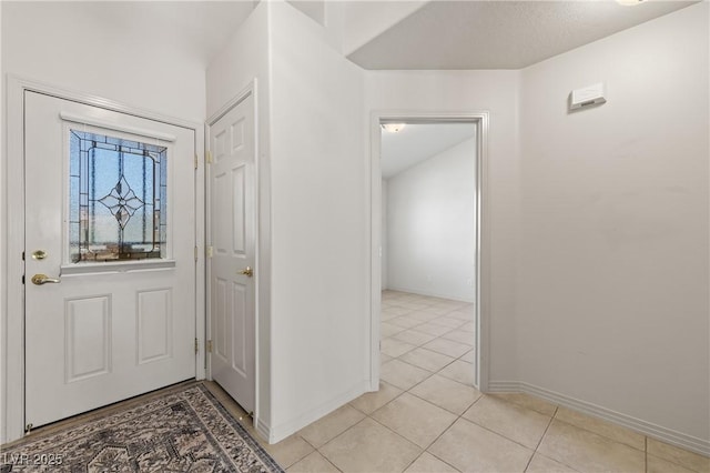 871 Falcon Glenn Dr, Mesquite, NV 89027 - foyer with light tile patterned floors and baseboards