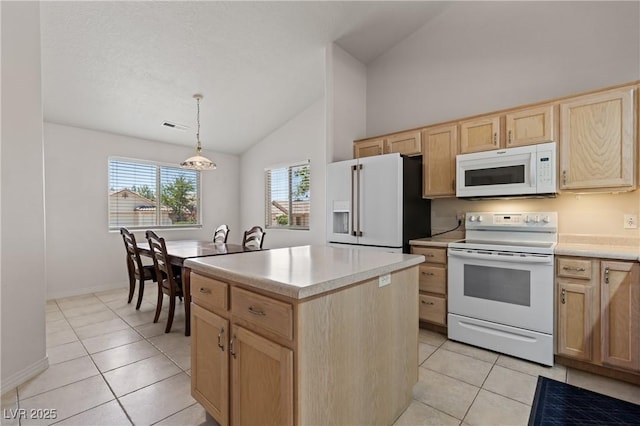 871 Falcon Glenn Dr, Mesquite, NV 89027 - kitchen featuring light brown cabinetry, white appliances, light tile patterned flooring, a center island, and high vaulted ceiling