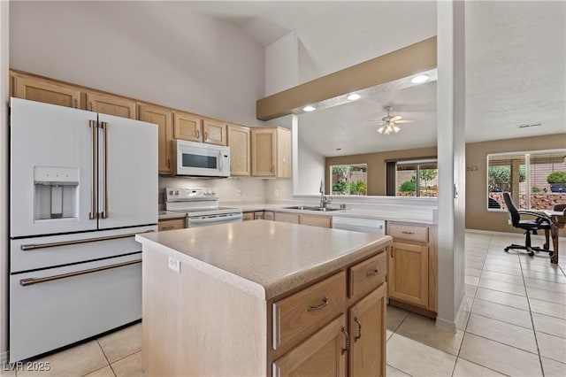 871 Falcon Glenn Dr, Mesquite, NV 89027 - kitchen with white appliances, light brown cabinetry, light tile patterned floors, a kitchen island, and light countertops