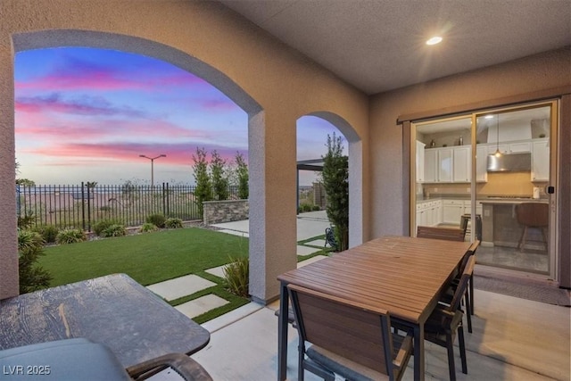 342 Molinetto St, Las Vegas, NV 89138 - patio terrace at dusk with a patio and outdoor dining area