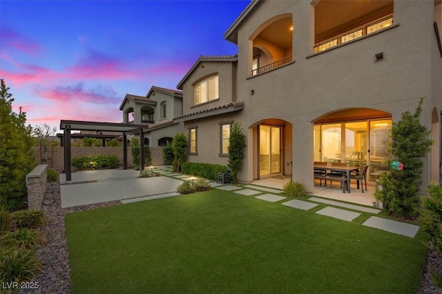 342 Molinetto St, Las Vegas, NV 89138 - rear view of property with a patio, a fenced backyard, and stucco siding