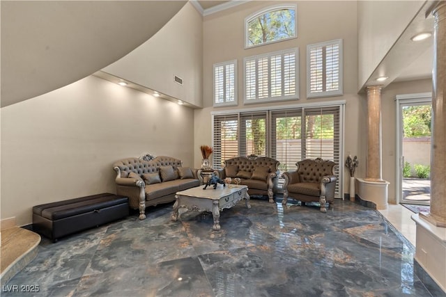 8215 Crow Valley Ln, Las Vegas, NV 89113 - living area with decorative columns, a high ceiling, and ornamental molding