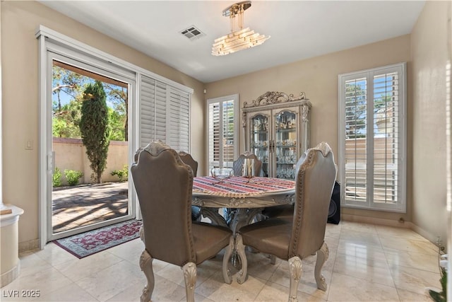 8215 Crow Valley Ln, Las Vegas, NV 89113 - dining room with baseboards