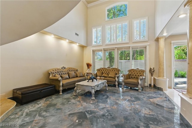 8215 Crow Valley Ln, Las Vegas, NV 89113 - living area featuring a towering ceiling, decorative columns, and crown molding